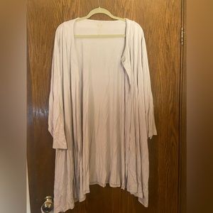 Cardigan with a single mother of pearl button at the top.